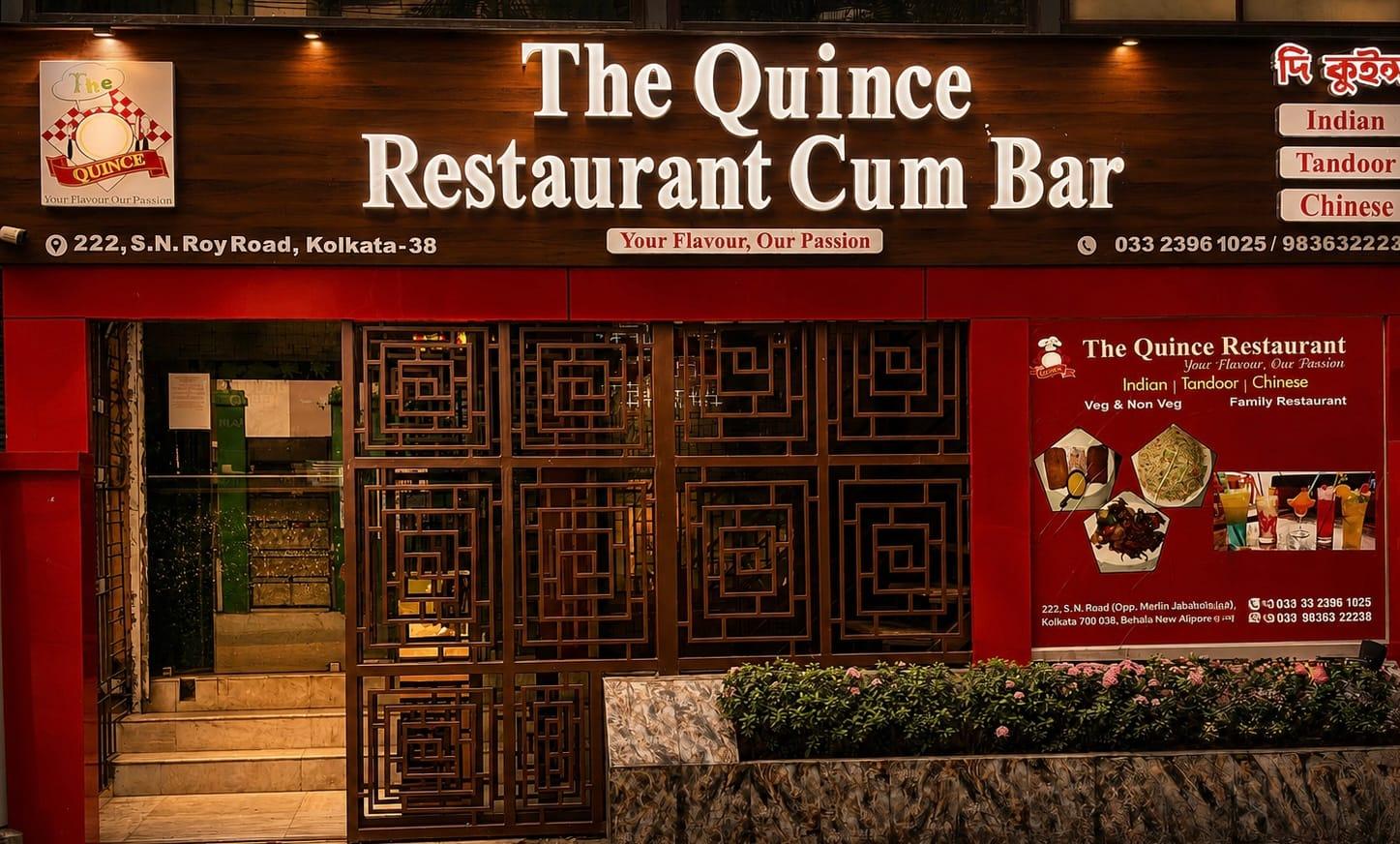 The Quince restaurant exterior at twilight with warm lighting and the entrance in view.